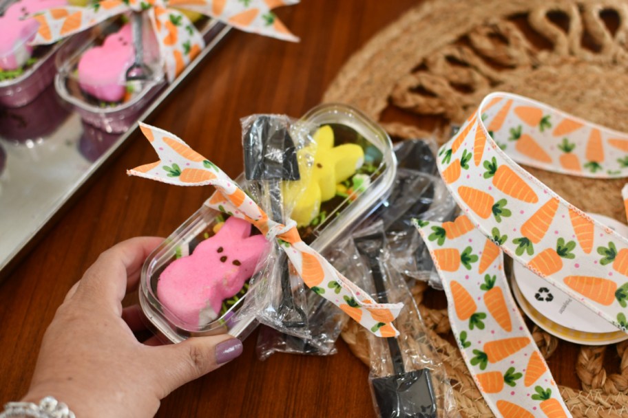 adding ribbon and a shovel spoon to easter dirt cake