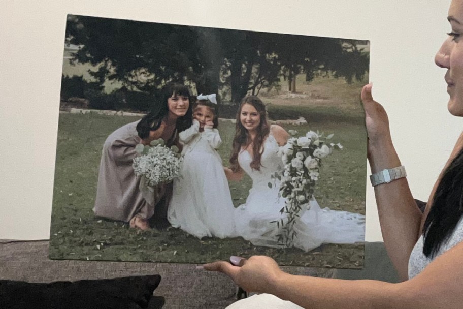 woman holding canvas print