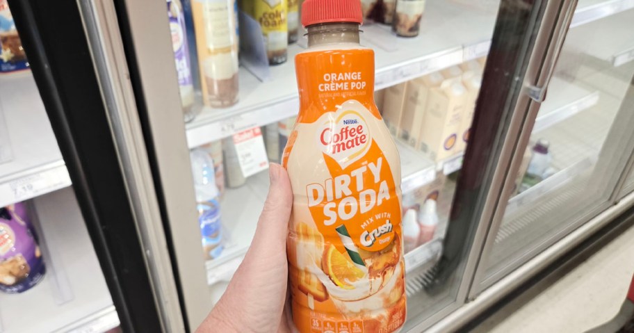 hand holding coffee mate dirty soda creamer 