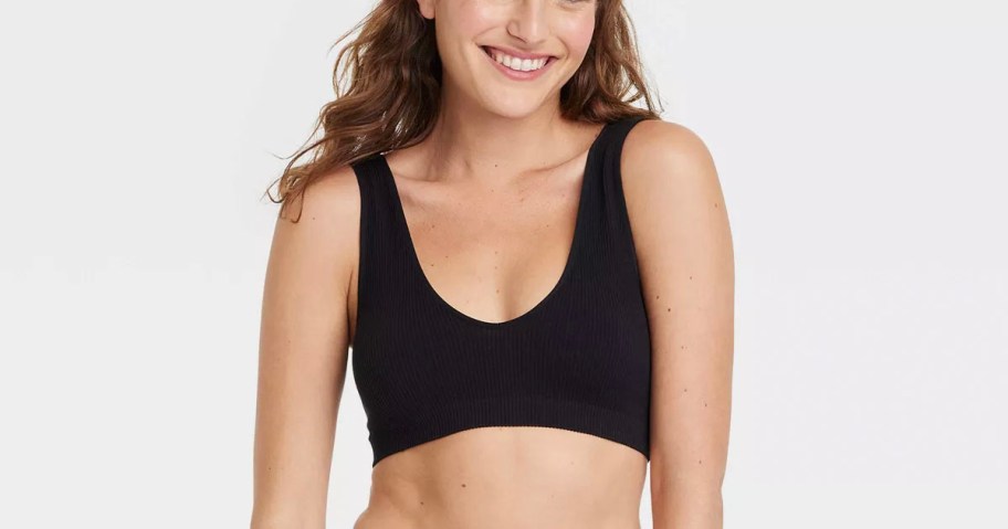 woman wearing black bralette