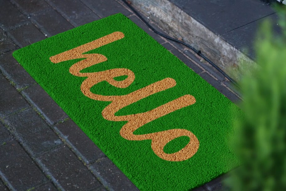 green doormat with yellow hello letters