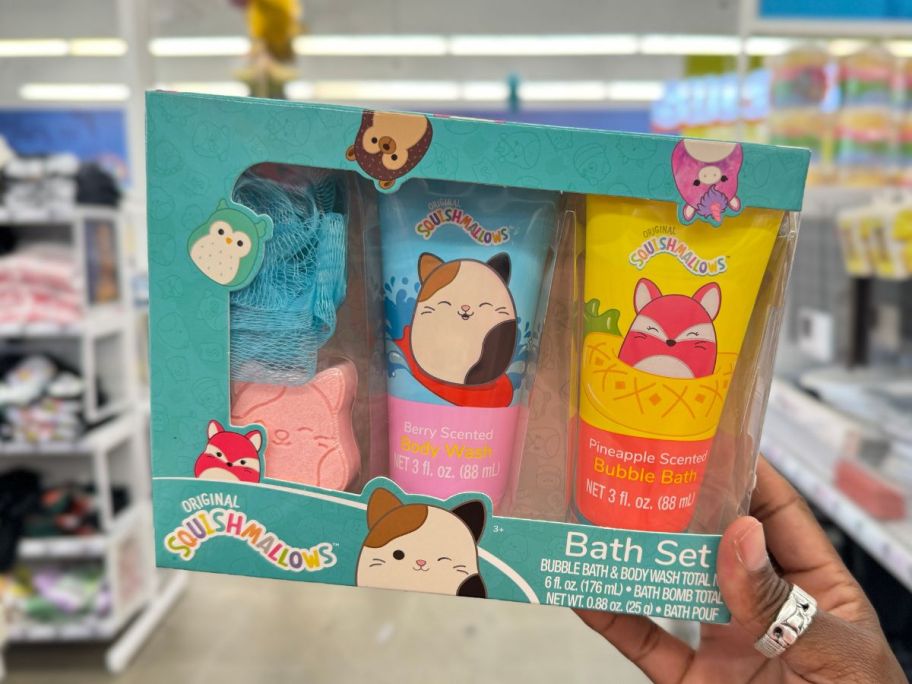 hand holding a Squishmallows bath set