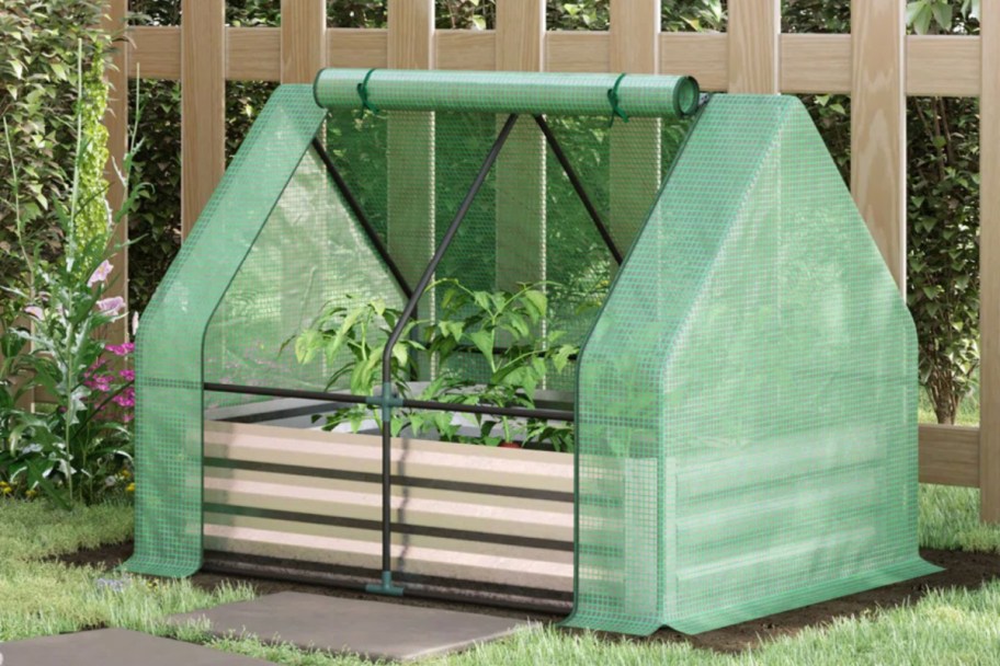 steel planter box with green greenhouse cover