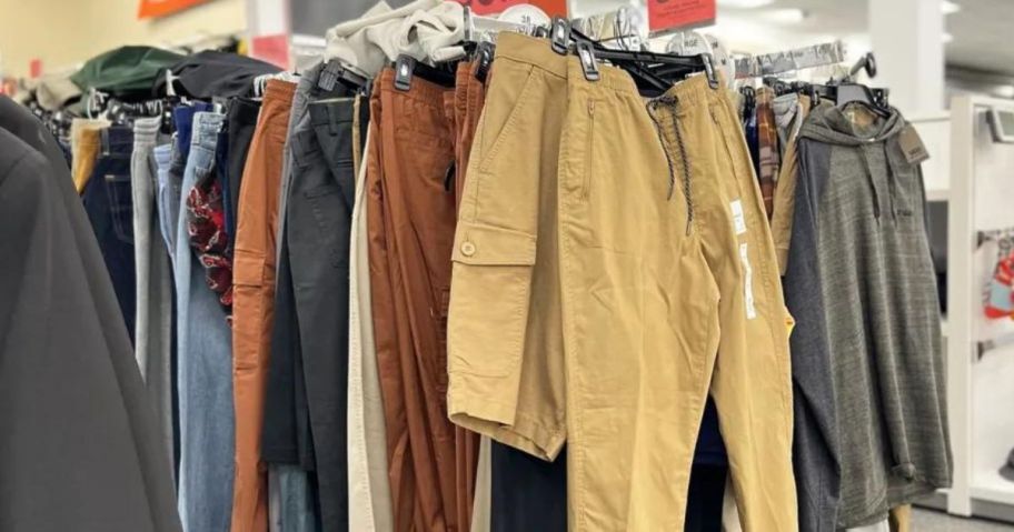 men's clearance rack with clothes on it in store
