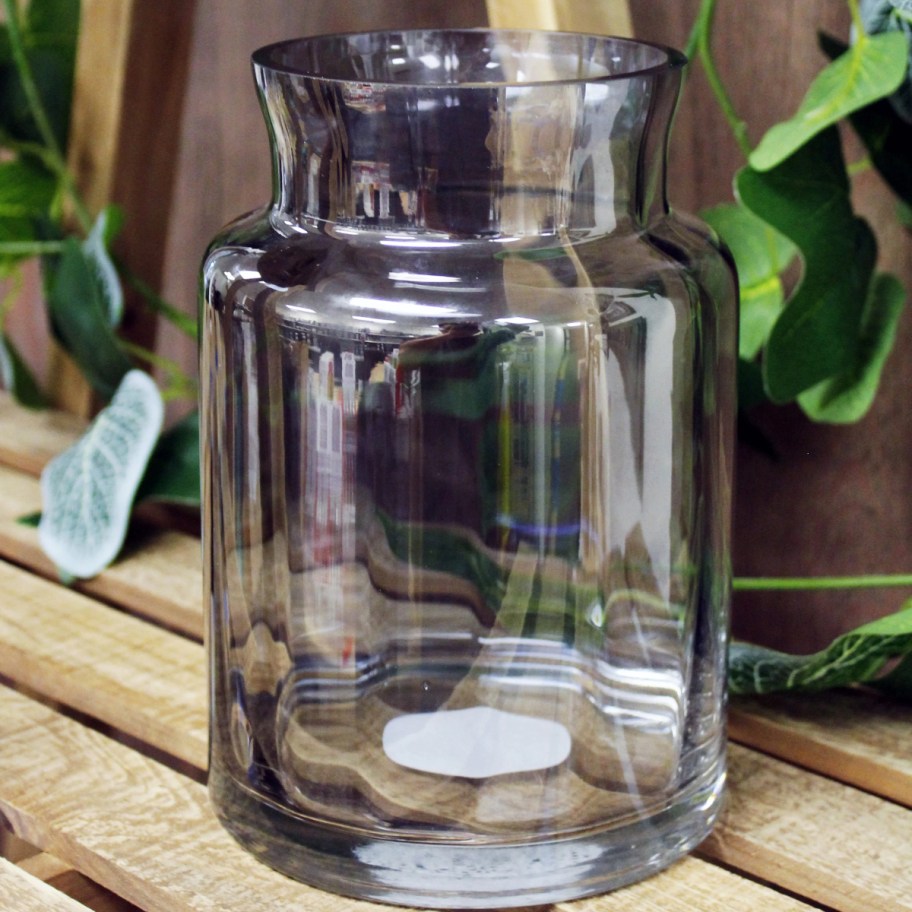 empty gray vase on wooden surface