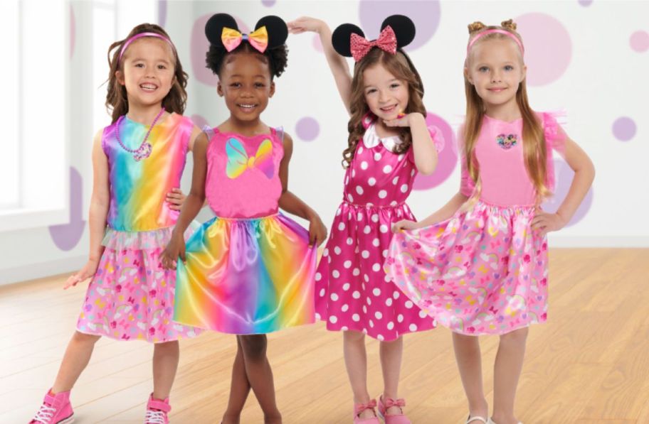 4 little girls in minnie mouse dress up costumes