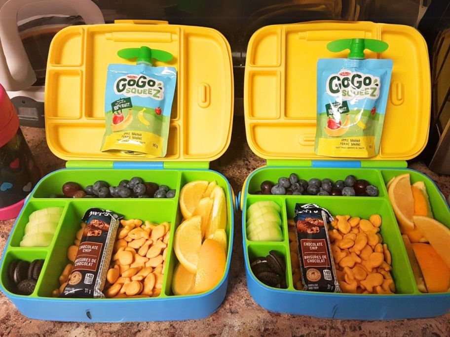 two bento boxes next to each other on counter