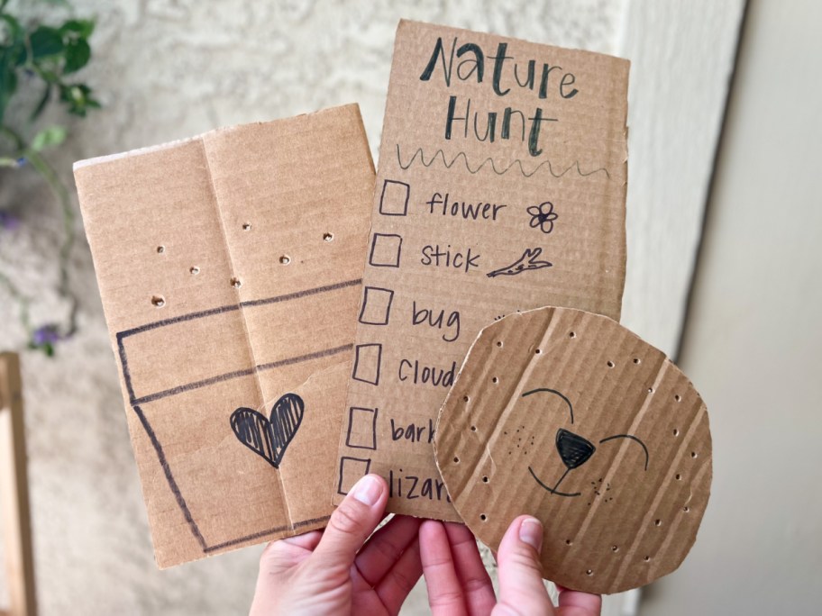 hands holding recycled box crafts