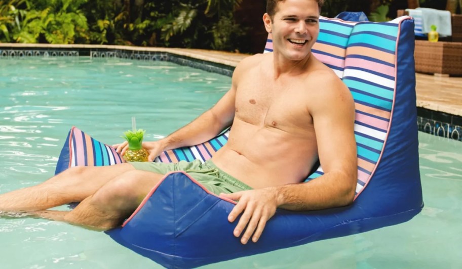 man sitting in big joe captain's chair pool float