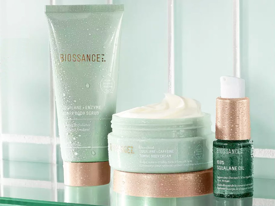 green Biossance products on glass shelf