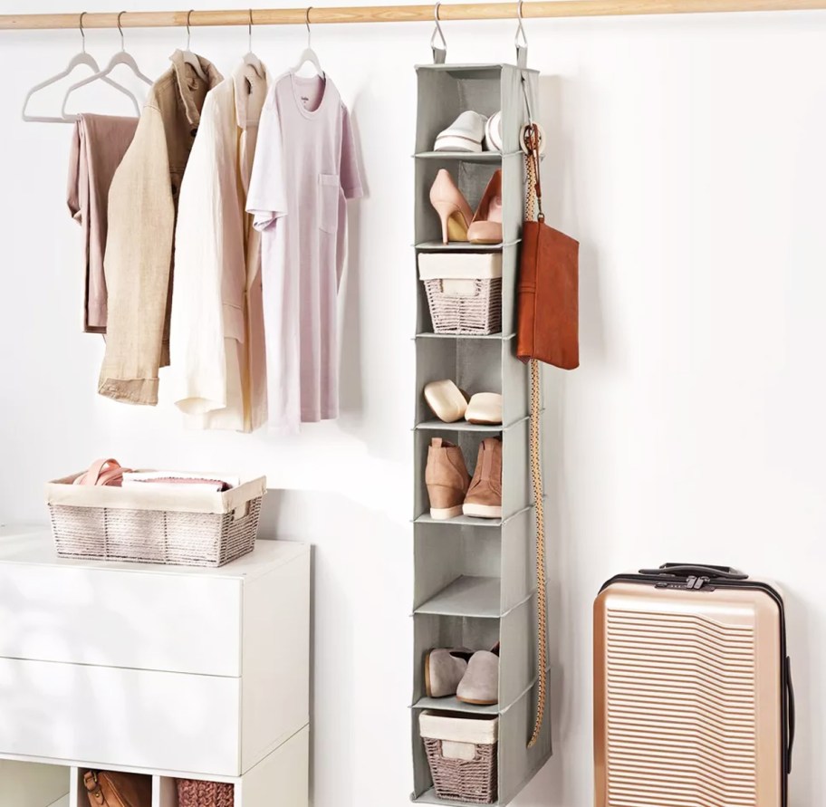 long grey shoe organizer hanging in closet