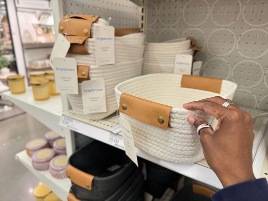 A hand holding a Brightroom Coiled Baskets in White in Target