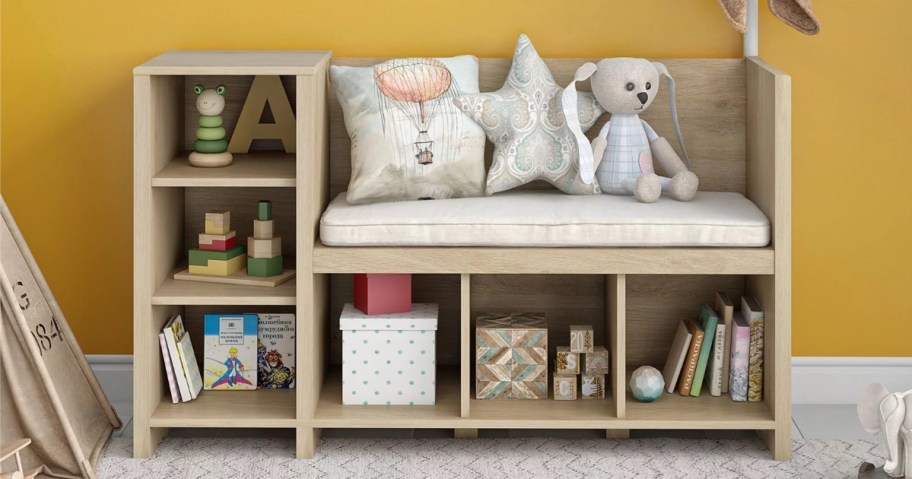 kid's storage cubby, bench and coat rack furniture piece in a kids room with toys and other items