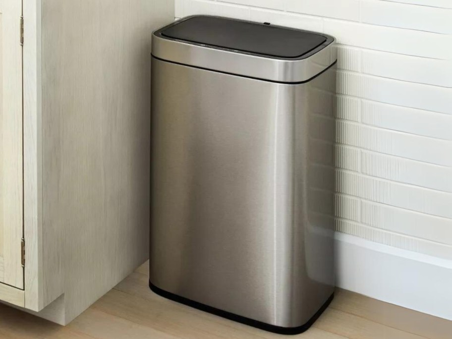 metal and black trash can in a kitchen