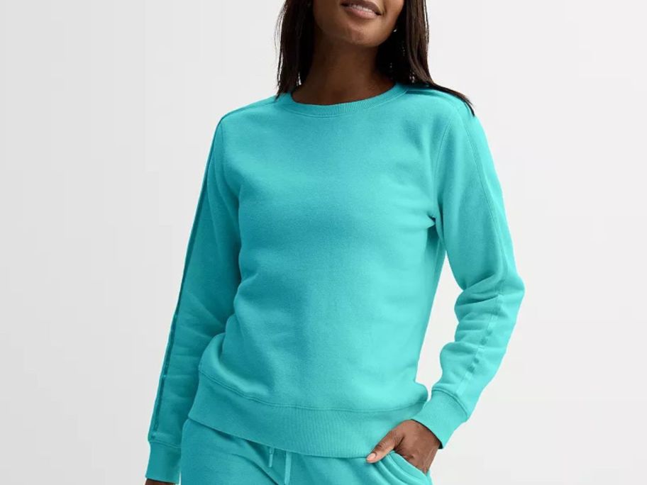 woman wearing a Women's Tek Gear Ultrasoft Fleece Taped Crewneck Top