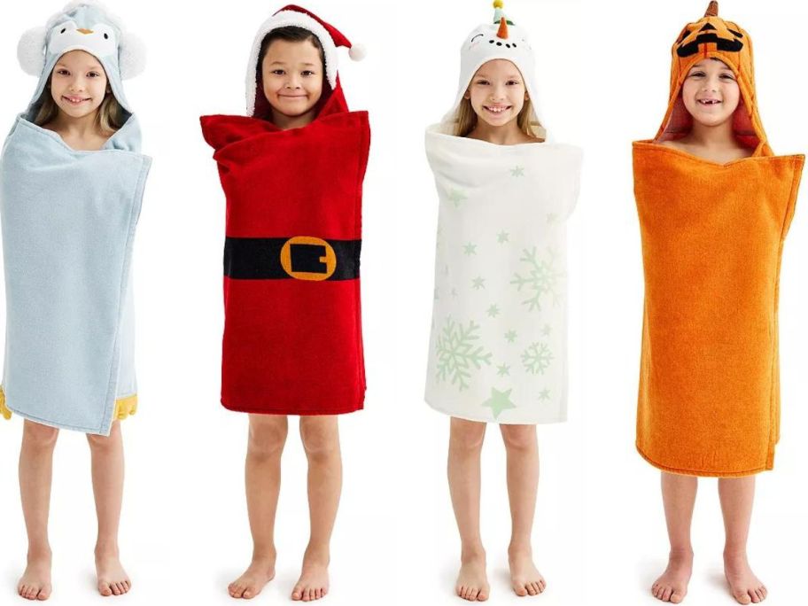 Four Kids wearing The Big One Hooded Holiday Bath Towels