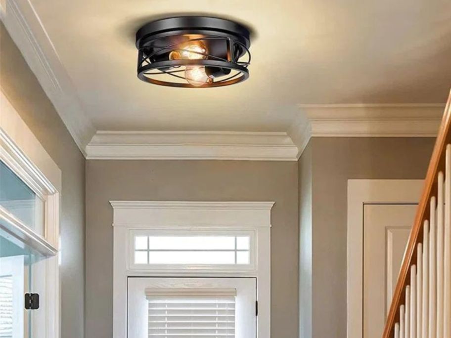 Pynsseu 2-Light Black Flush Mount Ceiling Light Fixture in an entryway