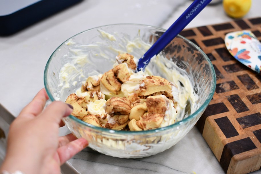 bowl of cinnamon rolls with cream cheese