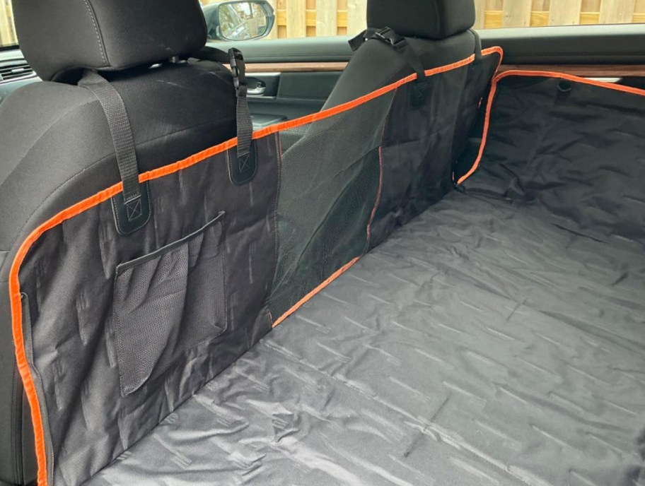 black pet car seat cover in back of a suv