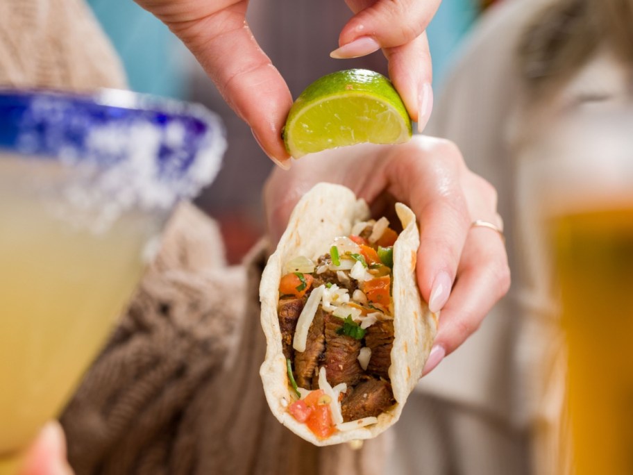 squeezing lime on a taco