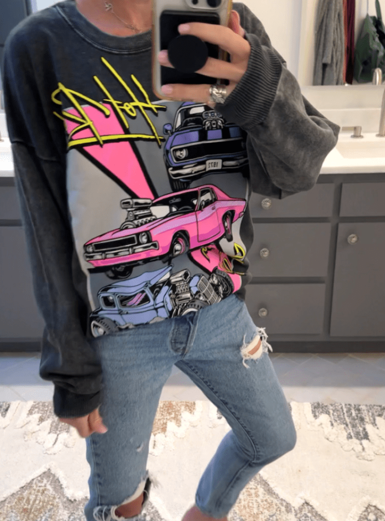 woman wearing No Boundaries oversized graphic sweatshirt 