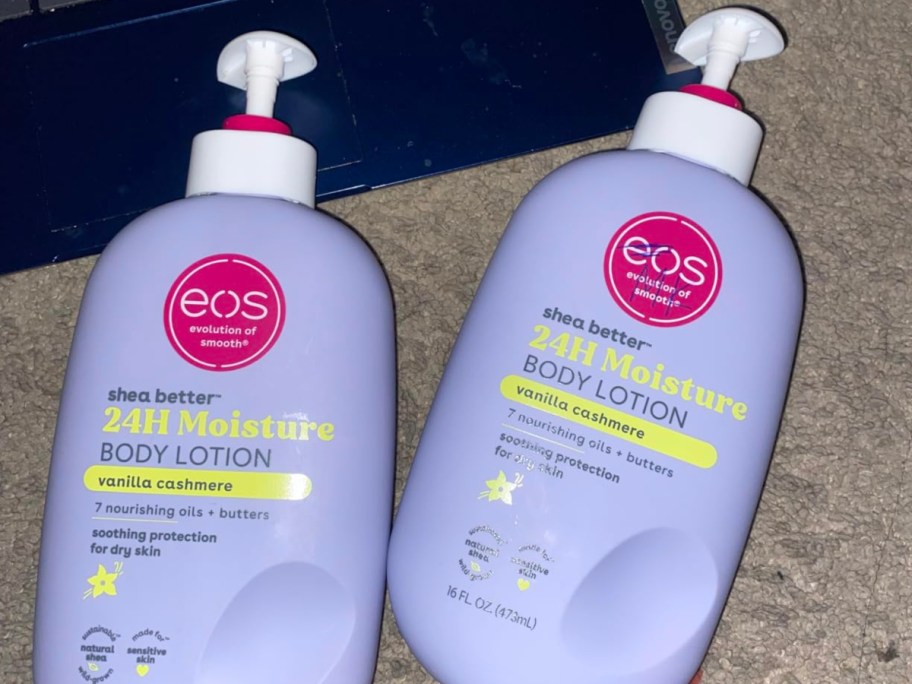 two purple bottles of body lotion