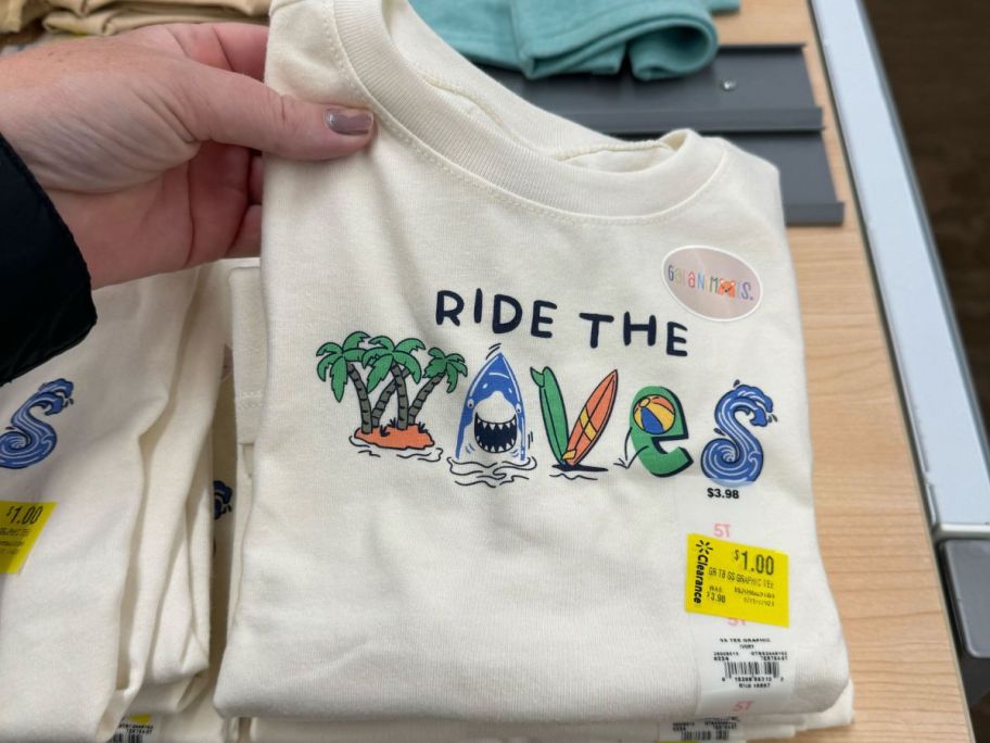 walmart garanimals kids shirt being held by hand in store