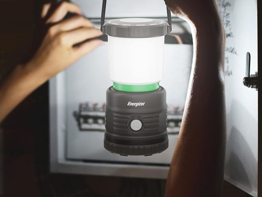 Energizer LED Camping Lantern being held in front of breaker box
