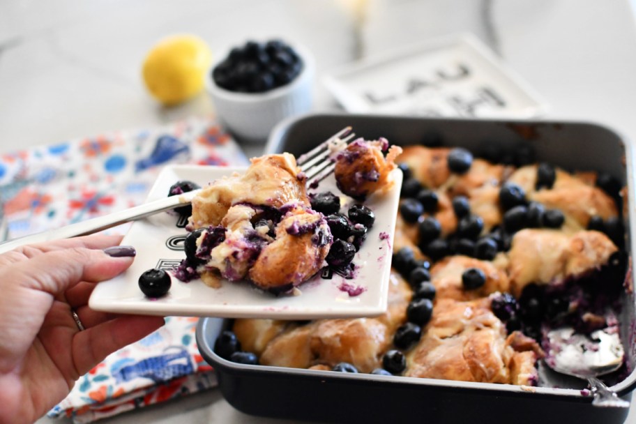 small plate with blueberry lemon cinnamon roll cake