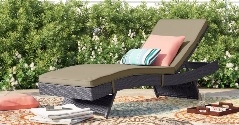 chaise lounge chair with olive green cushions and throw pillows