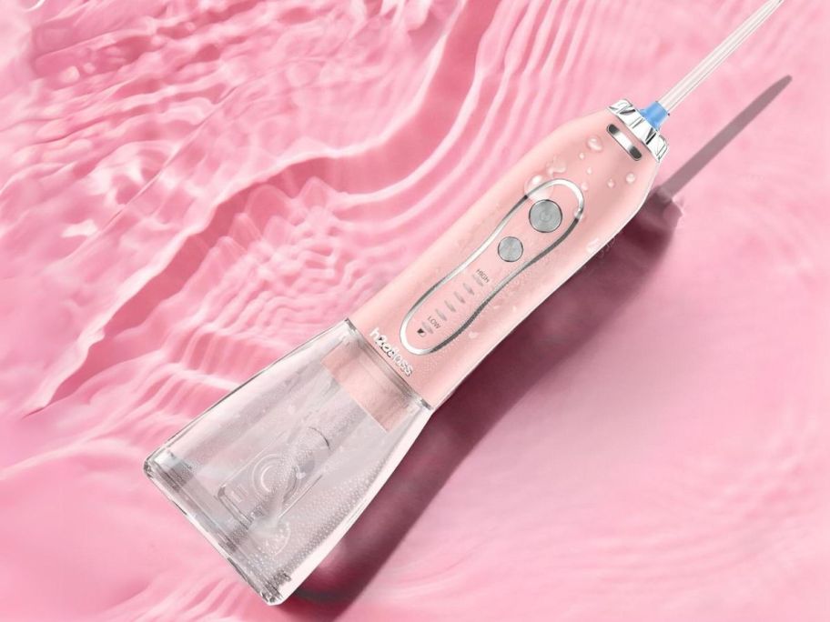 H2ofloss Water Dental Flosser with pink background