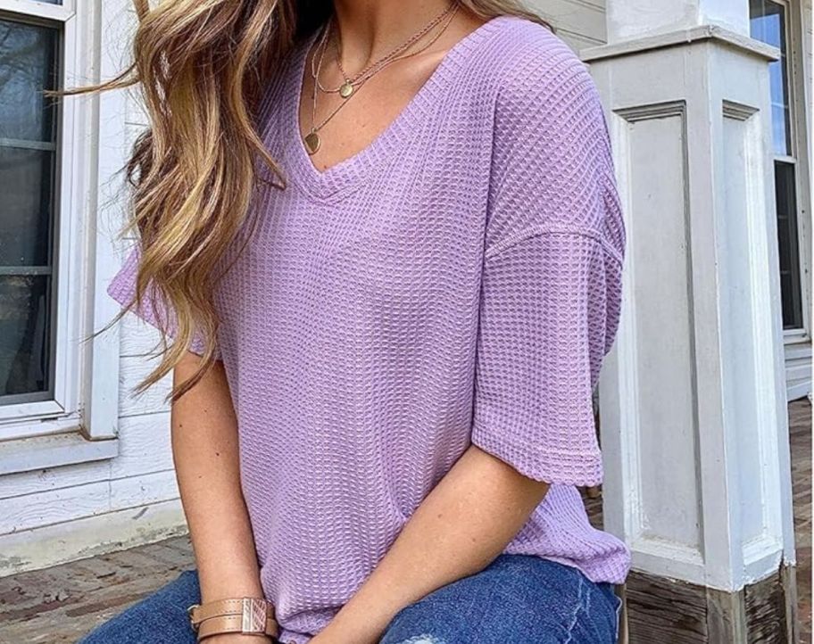 A woman wearing a Merokeety Women’s V Neck Batwing Half Sleeve Shirt in purple