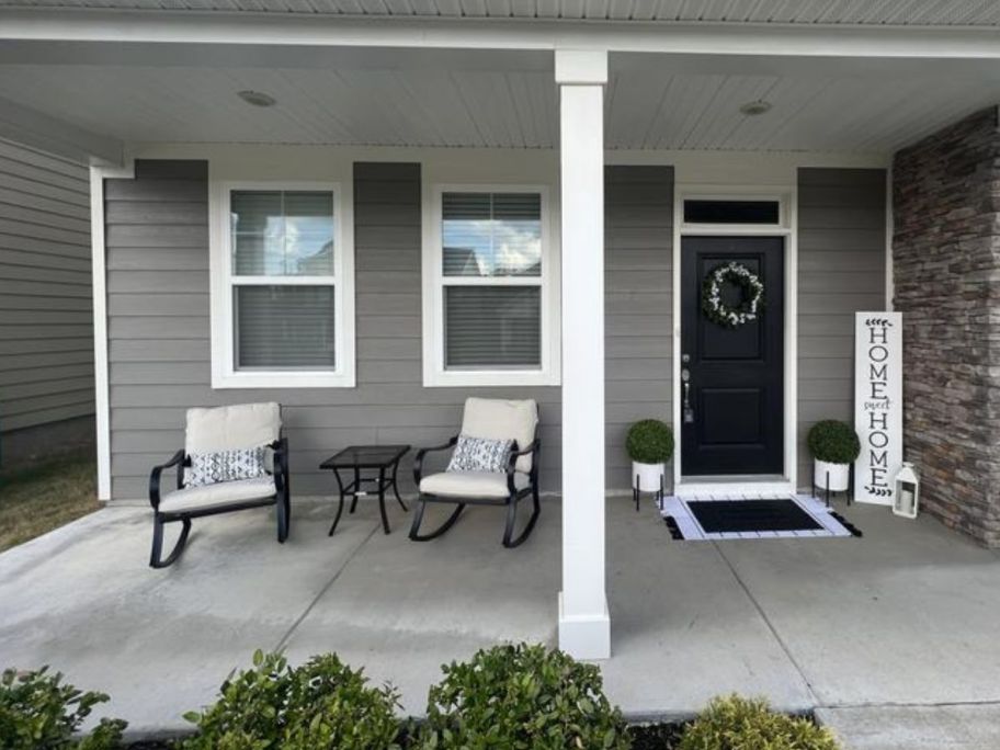 A porch with a Mosaic Patio Set on it