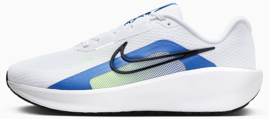 white and blue nike running shoe