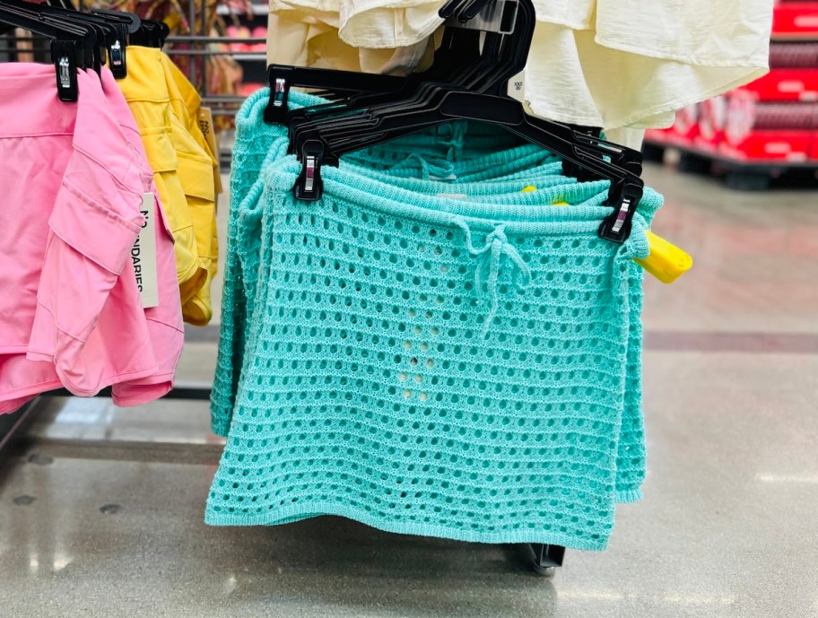 blue mesh skirt hanging on store hanger