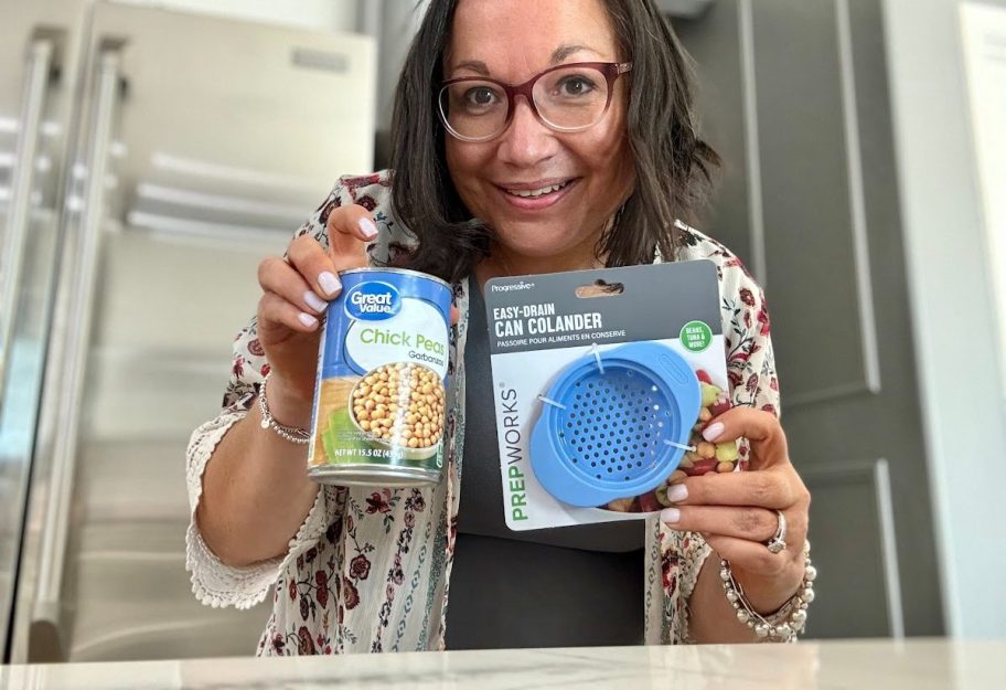 woman holding up a can colander