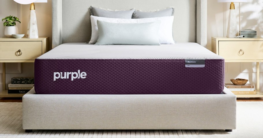 purple mattress on an upholstered bed frame