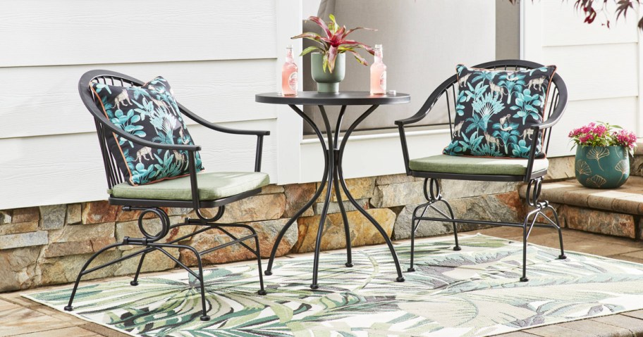 3 piece patio bistro set on an area rug