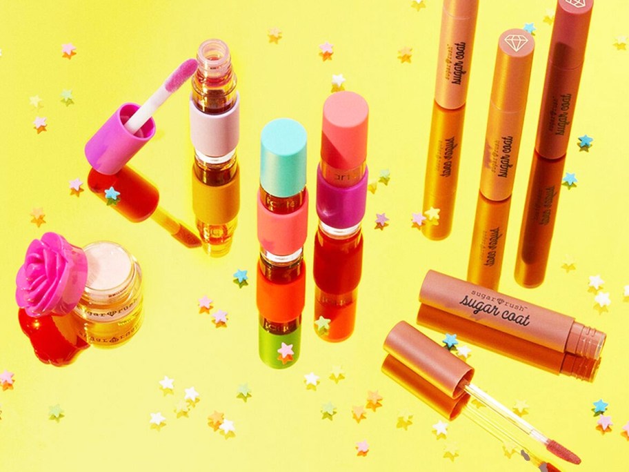 Tarte Sugar Rush products on yellow background with sprinkles