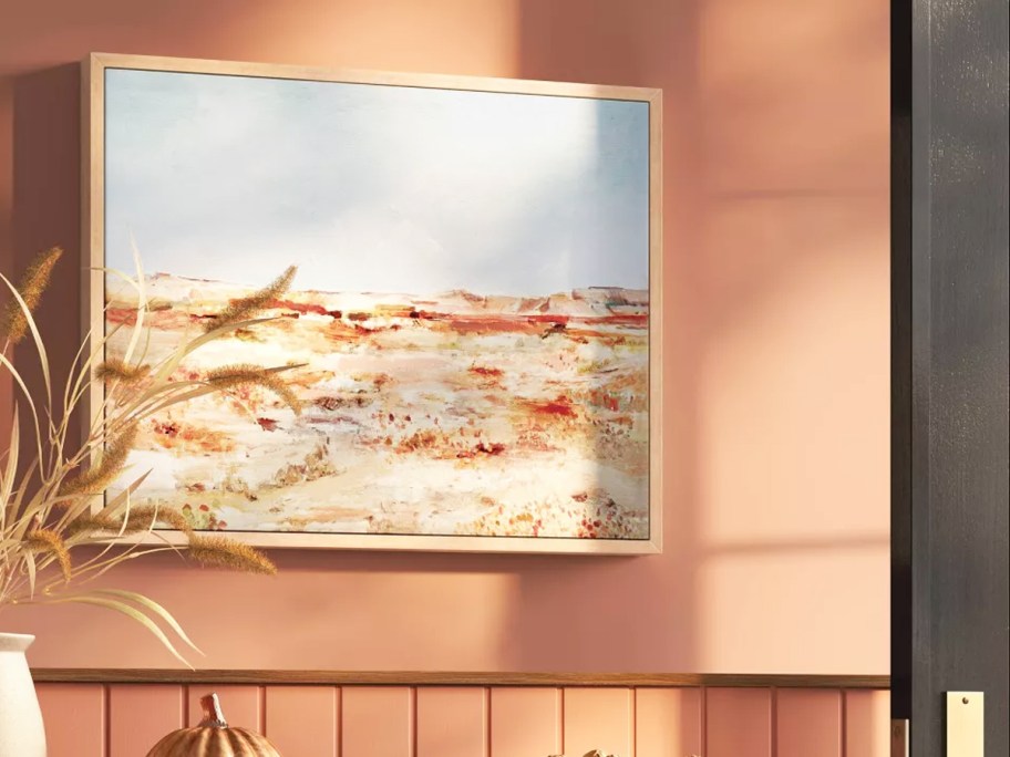 framed landscape picture on wall