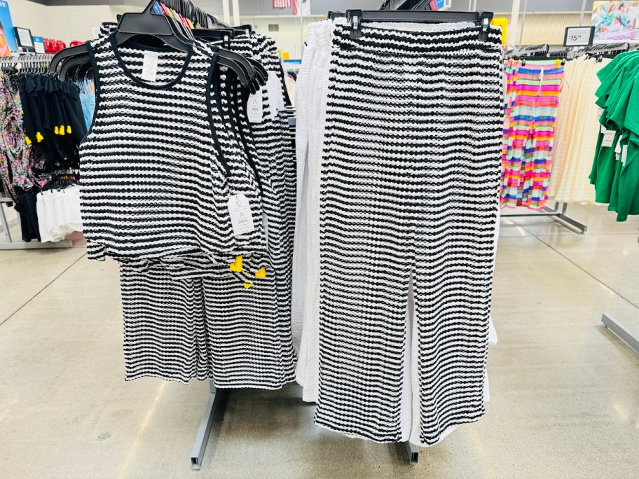 stripe crop top and pants hanging on store shelves