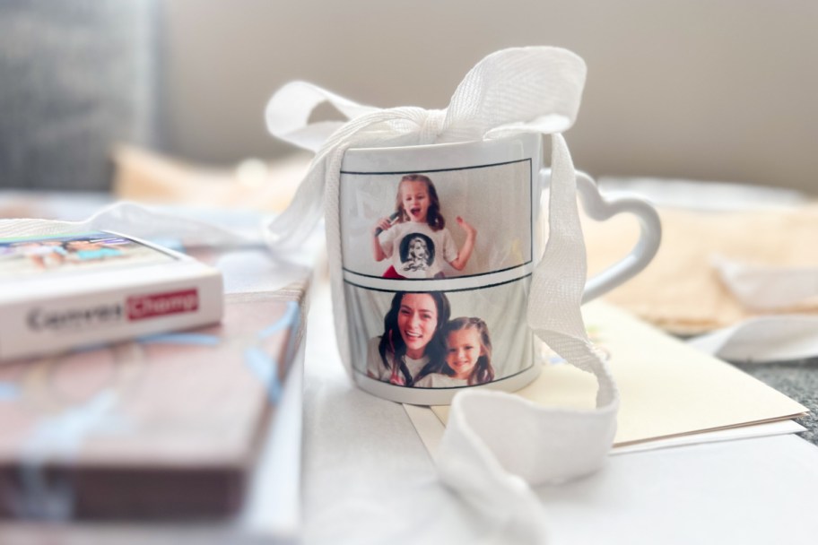 white photo mug with ribbon on it