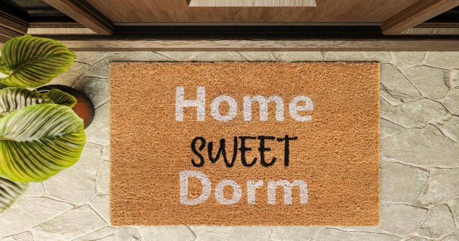 home sweet dorm doormat on concrete porch