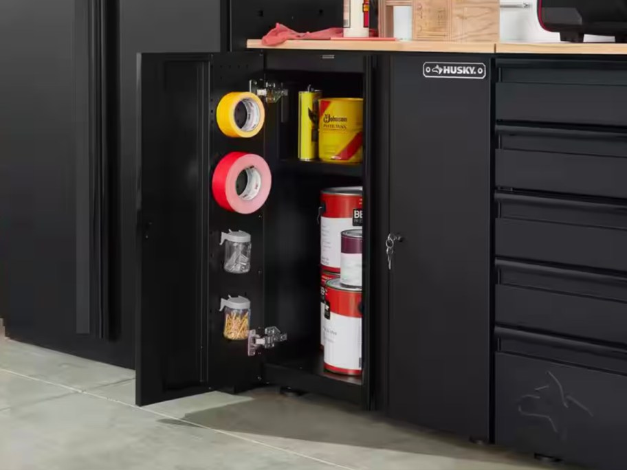 black husky garage cabinet with supplies inside