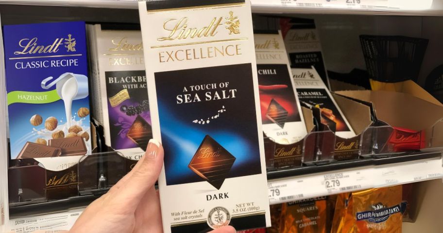 lindt chocolate bar in hand in store