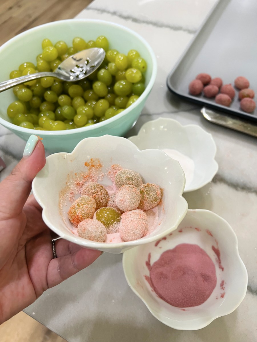 making sour patch grapes in a bowl 