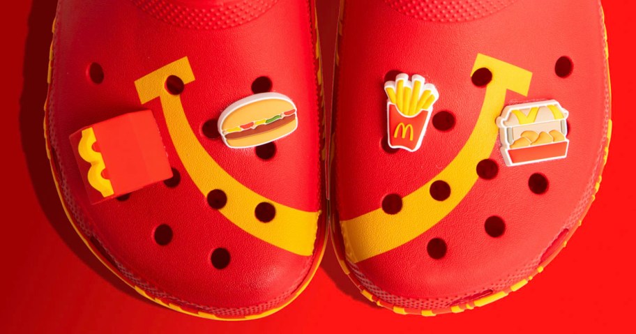 red crocs with happy meal charms on them