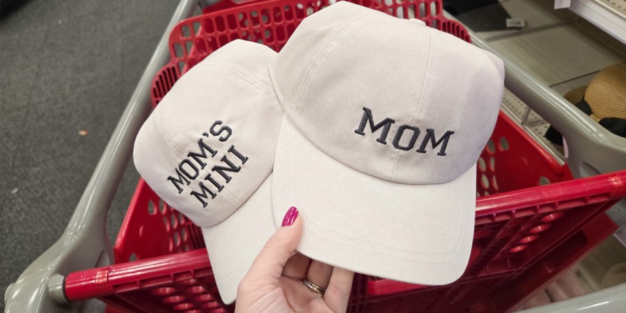 hand holding mom and mom's mini hats 