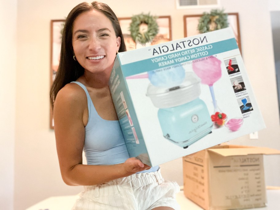 woman holding nostalgia cotton candy maker box