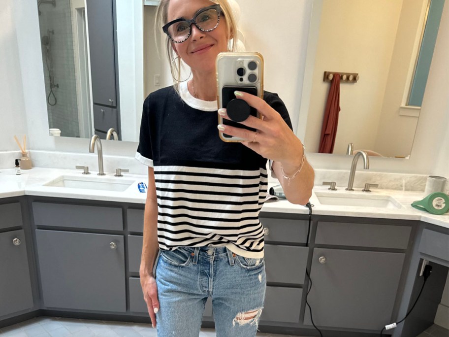 woman wearing black and white ribbed top